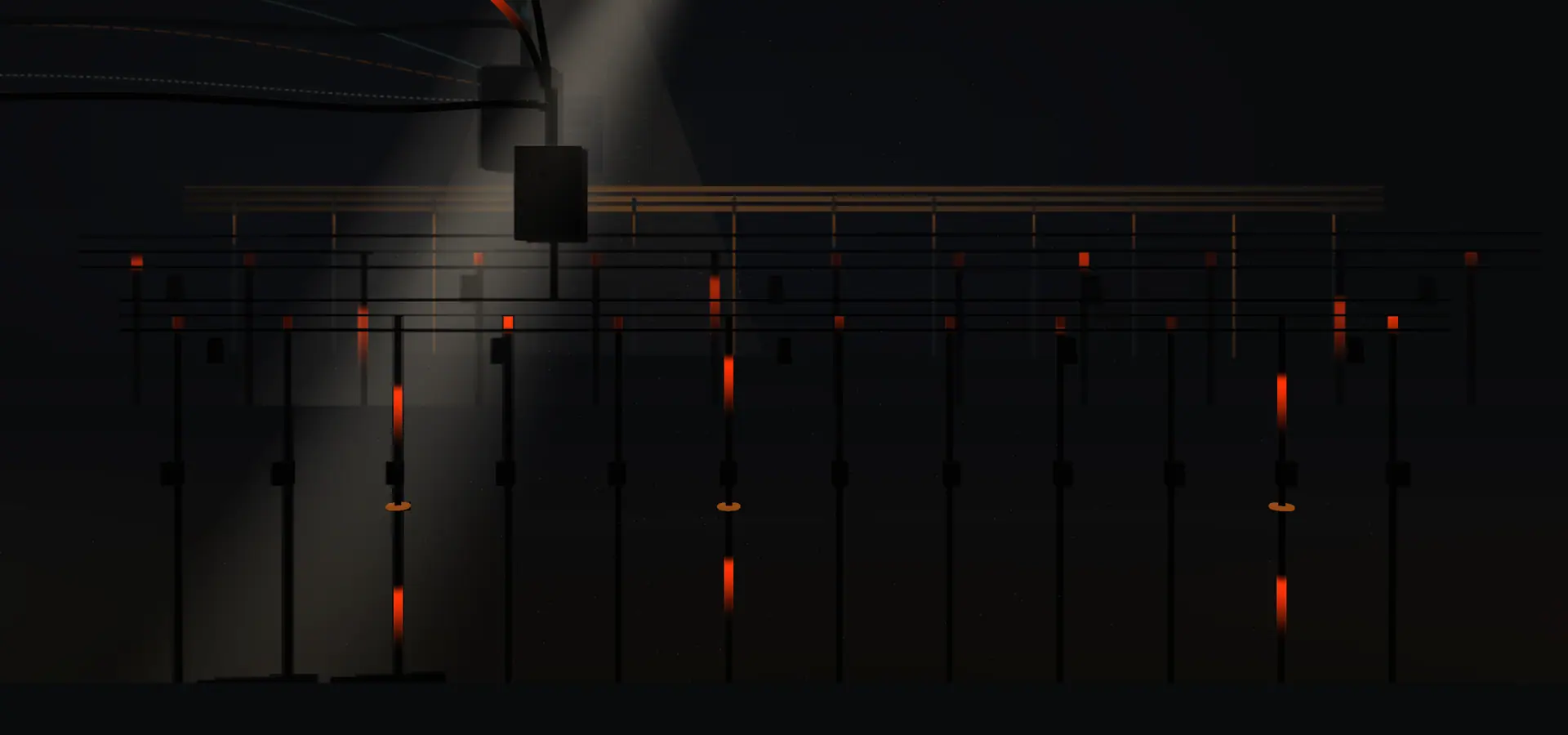 The whole board seen square on: one incomer feeding a copper busbar, twelve ways dropping away from it, three of them carrying current the full drop and nine stopping a few centimetres below the bar.